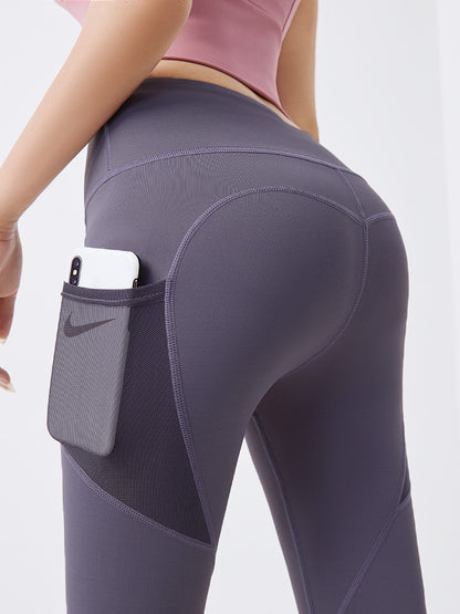 Thin fitness pants with mesh side pockets